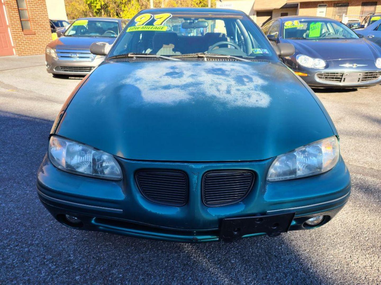 1998 GREEN PONTIAC GRAND AM SE (1G2NE52T4WM) with an 2.4L engine, Automatic transmission, located at 117 North Cameron Street, Harrisburg, PA, 17101, (717) 963-8962, 40.266762, -76.875259 - WE FINANCE!!! Good Credit/ Bad Credit/ No Credit - ALL Trade-Ins Welcomed!!! ***Guaranteed Credit Approval*** APPLY ONLINE or CALL us TODAY ;) Internet Prices and Marketplace Prices are SPECIAL discounted ***CASH DEALS*** Retail Prices are higher. Please call us to discuss your cash and finan - Photo#7