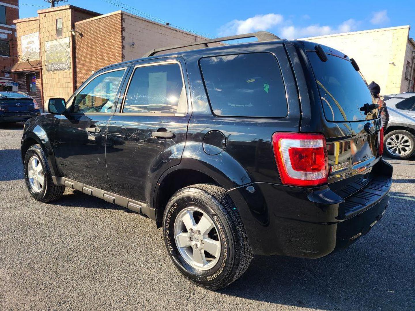 2010 BLACK FORD ESCAPE XLT (1FMCU9D75AK) with an 2.5L engine, Automatic transmission, located at 117 North Cameron Street, Harrisburg, PA, 17101, (717) 963-8962, 40.266762, -76.875259 - WE FINANCE!!! Good Credit/ Bad Credit/ No Credit - ALL Trade-Ins Welcomed!!! ***Guaranteed Credit Approval*** APPLY ONLINE or CALL us TODAY ;) Internet Prices and Marketplace Prices are SPECIAL discounted ***CASH DEALS*** Retail Prices are higher. Please call us to discuss your cash and finan - Photo#2