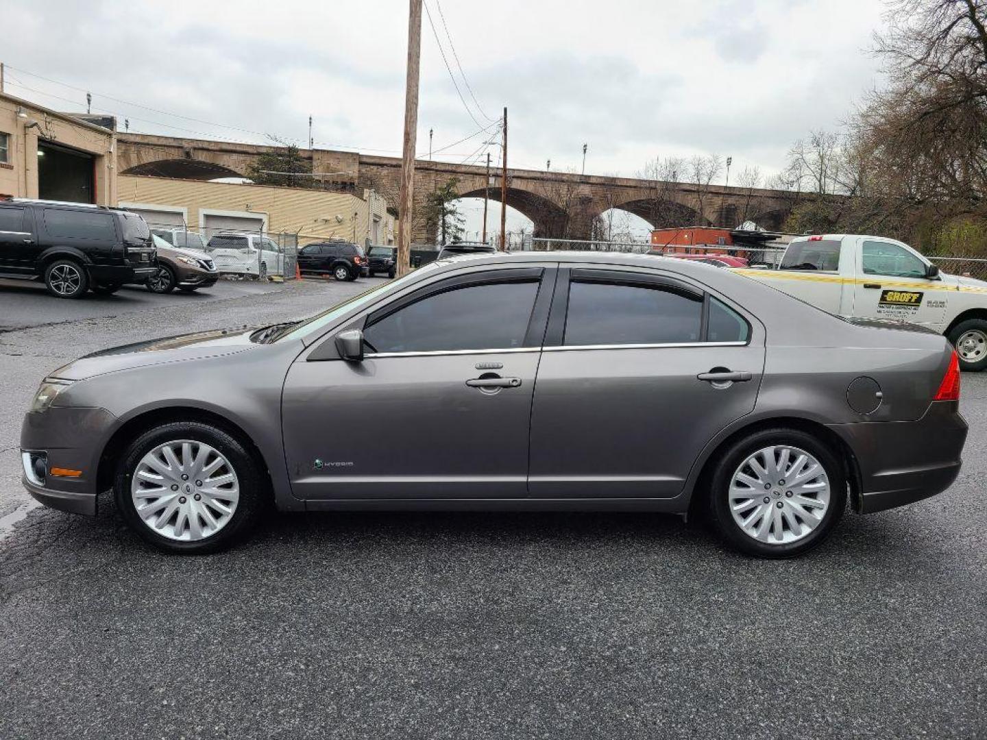 2010 GRAY FORD FUSION HYBRID (3FADP0L35AR) with an 2.5L engine, Continuously Variable transmission, located at 117 North Cameron Street, Harrisburg, PA, 17101, (717) 963-8962, 40.266762, -76.875259 - WE FINANCE!!! Good Credit/ Bad Credit/ No Credit - ALL Trade-Ins Welcomed!!! ***Guaranteed Credit Approval*** APPLY ONLINE or CALL us TODAY ;) Internet Prices and Marketplace Prices are SPECIAL discounted ***CASH DEALS*** Retail Prices are higher. Please call us to discuss your cash and finan - Photo#1