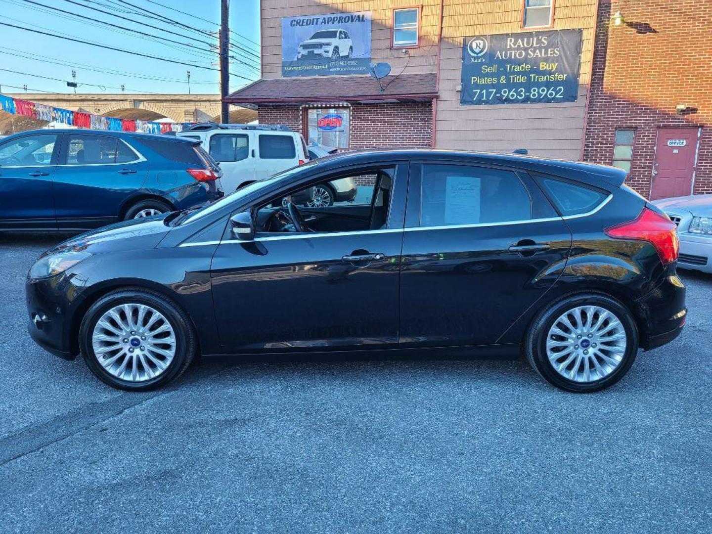 2012 BLACK FORD FOCUS TITANIUM (1FAHP3N27CL) with an 2.0L engine, Automatic transmission, located at 117 North Cameron Street, Harrisburg, PA, 17101, (717) 963-8962, 40.266762, -76.875259 - WE FINANCE!!! Good Credit/ Bad Credit/ No Credit - ALL Trade-Ins Welcomed!!! ***Guaranteed Credit Approval*** APPLY ONLINE or CALL us TODAY ;) Internet Prices and Marketplace Prices are SPECIAL discounted ***CASH DEALS*** Retail Prices are higher. Please call us to discuss your cash and finan - Photo#1