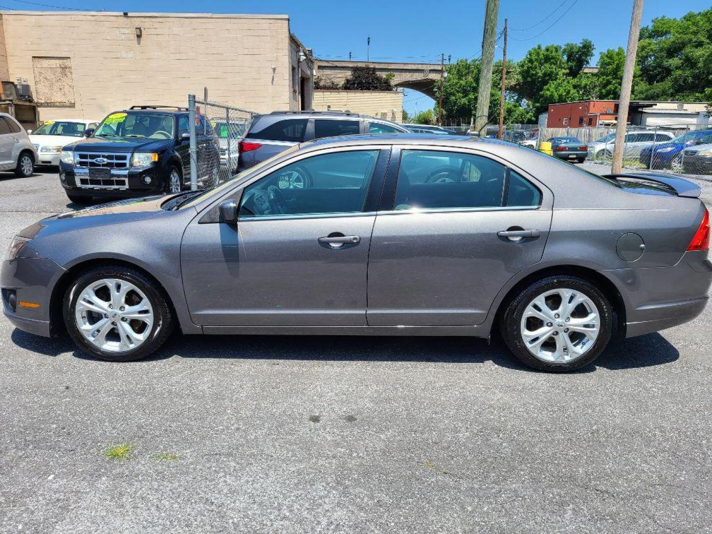 2012 GRAY FORD FUSION SE (3FAHP0HA0CR) with an 2.5L engine, Automatic transmission, located at 117 North Cameron Street, Harrisburg, PA, 17101, (717) 963-8962, 40.266762, -76.875259 - WE FINANCE!!! Good Credit/ Bad Credit/ No Credit - ALL Trade-Ins Welcomed!!! ***Guaranteed Credit Approval*** APPLY ONLINE or CALL us TODAY ;) Internet Prices and Marketplace Prices are SPECIAL discounted ***CASH DEALS*** Retail Prices are higher. Please call us to discuss your cash and finan - Photo#1