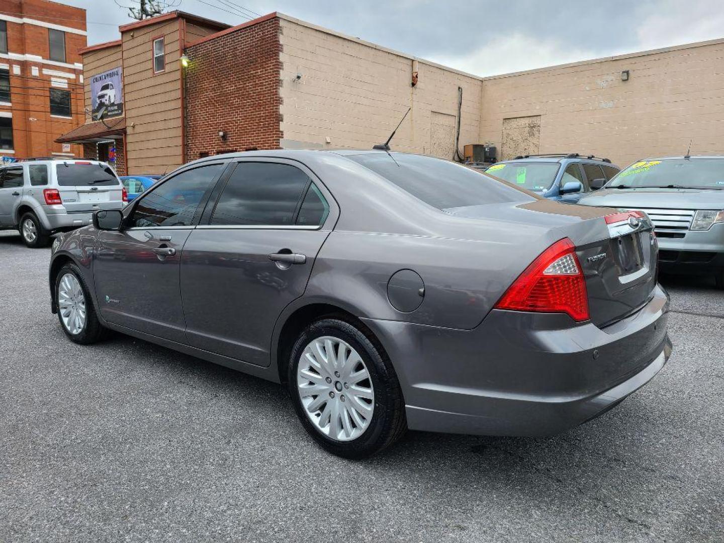 2012 GRAY FORD FUSION HYBRID (3FADP0L31CR) with an 2.5L engine, Continuously Variable transmission, located at 117 North Cameron Street, Harrisburg, PA, 17101, (717) 963-8962, 40.266762, -76.875259 - WE FINANCE!!! Good Credit/ Bad Credit/ No Credit - ALL Trade-Ins Welcomed!!! ***Guaranteed Credit Approval*** APPLY ONLINE or CALL us TODAY ;) Internet Prices and Marketplace Prices are SPECIAL discounted ***CASH DEALS*** Retail Prices are higher. Please call us to discuss your cash and finan - Photo#2