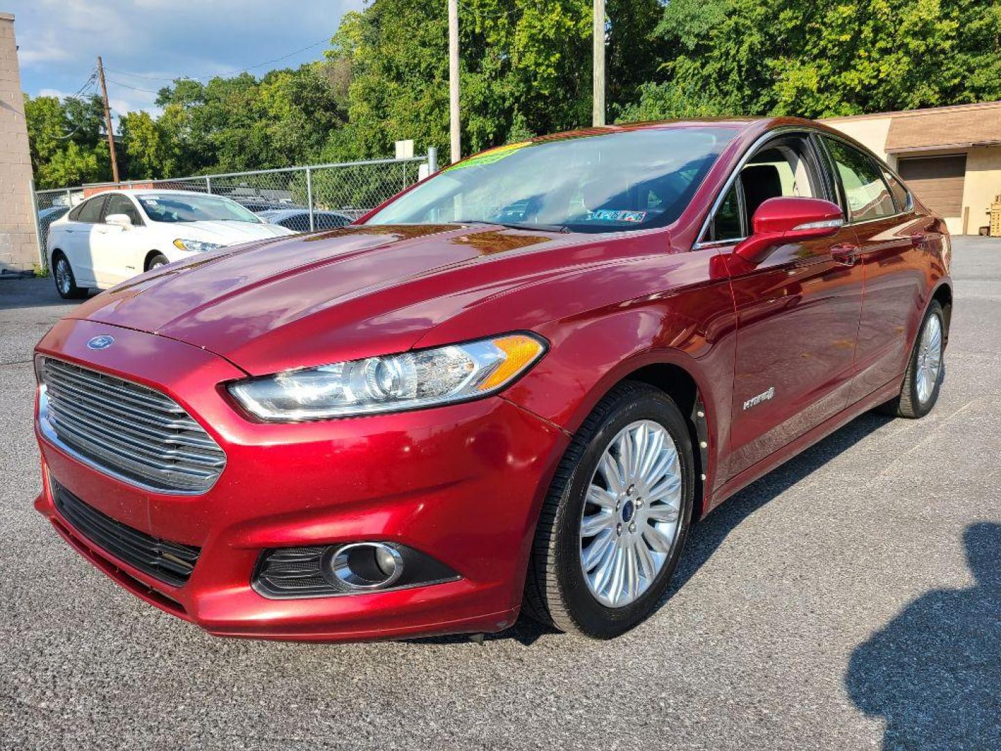 2013 RED FORD FUSION SE HYBRID (3FA6P0LU6DR) with an 2.0L engine, Continuously Variable transmission, located at 117 North Cameron Street, Harrisburg, PA, 17101, (717) 963-8962, 40.266762, -76.875259 - WE FINANCE!!! Good Credit/ Bad Credit/ No Credit - ALL Trade-Ins Welcomed!!! ***Guaranteed Credit Approval*** APPLY ONLINE or CALL us TODAY ;) Internet Prices and Marketplace Prices are SPECIAL discounted ***CASH DEALS*** Retail Prices are higher. Please call us to discuss your cash and finan - Photo#0