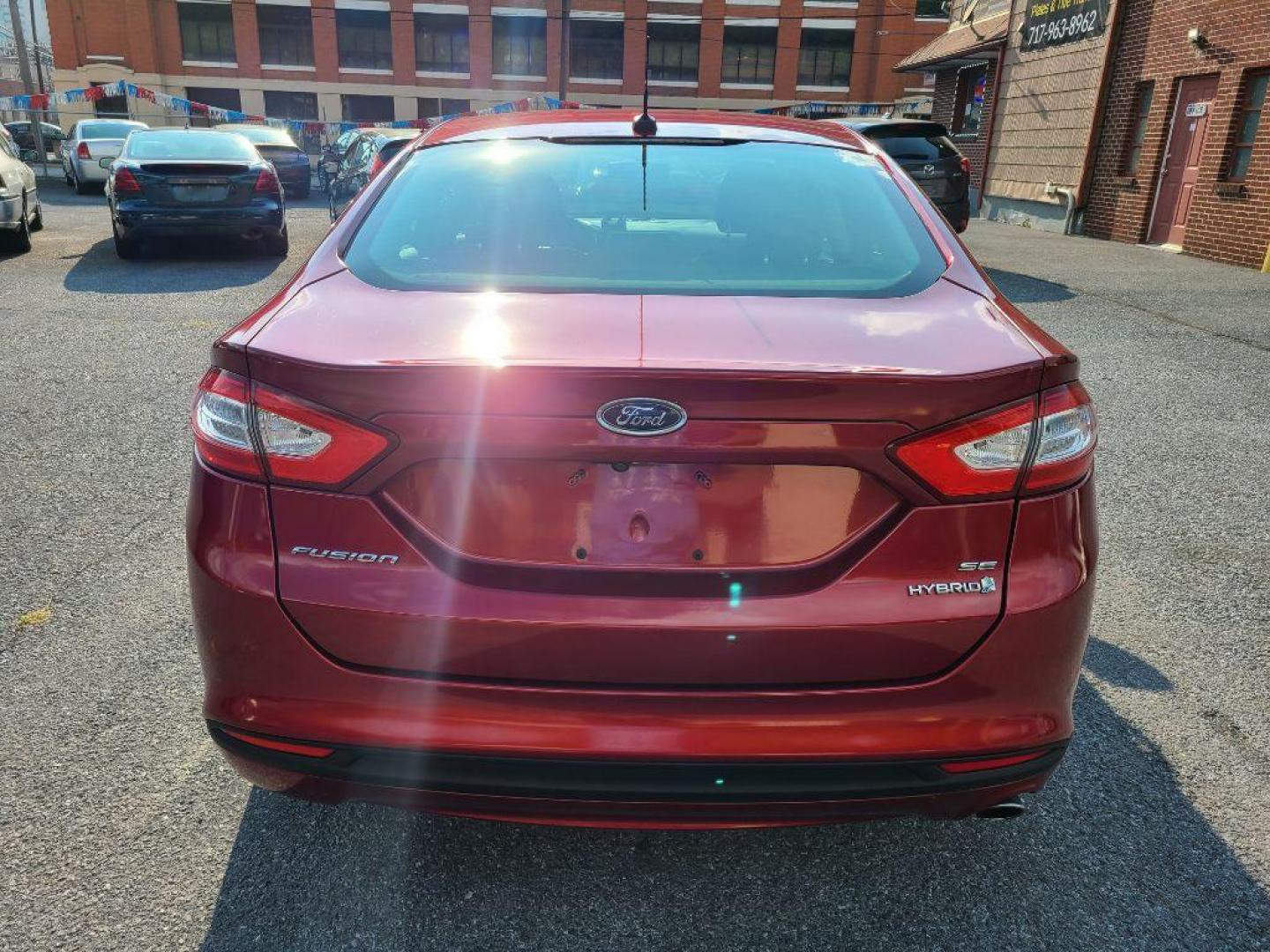 2013 RED FORD FUSION SE HYBRID (3FA6P0LU6DR) with an 2.0L engine, Continuously Variable transmission, located at 117 North Cameron Street, Harrisburg, PA, 17101, (717) 963-8962, 40.266762, -76.875259 - WE FINANCE!!! Good Credit/ Bad Credit/ No Credit - ALL Trade-Ins Welcomed!!! ***Guaranteed Credit Approval*** APPLY ONLINE or CALL us TODAY ;) Internet Prices and Marketplace Prices are SPECIAL discounted ***CASH DEALS*** Retail Prices are higher. Please call us to discuss your cash and finan - Photo#3