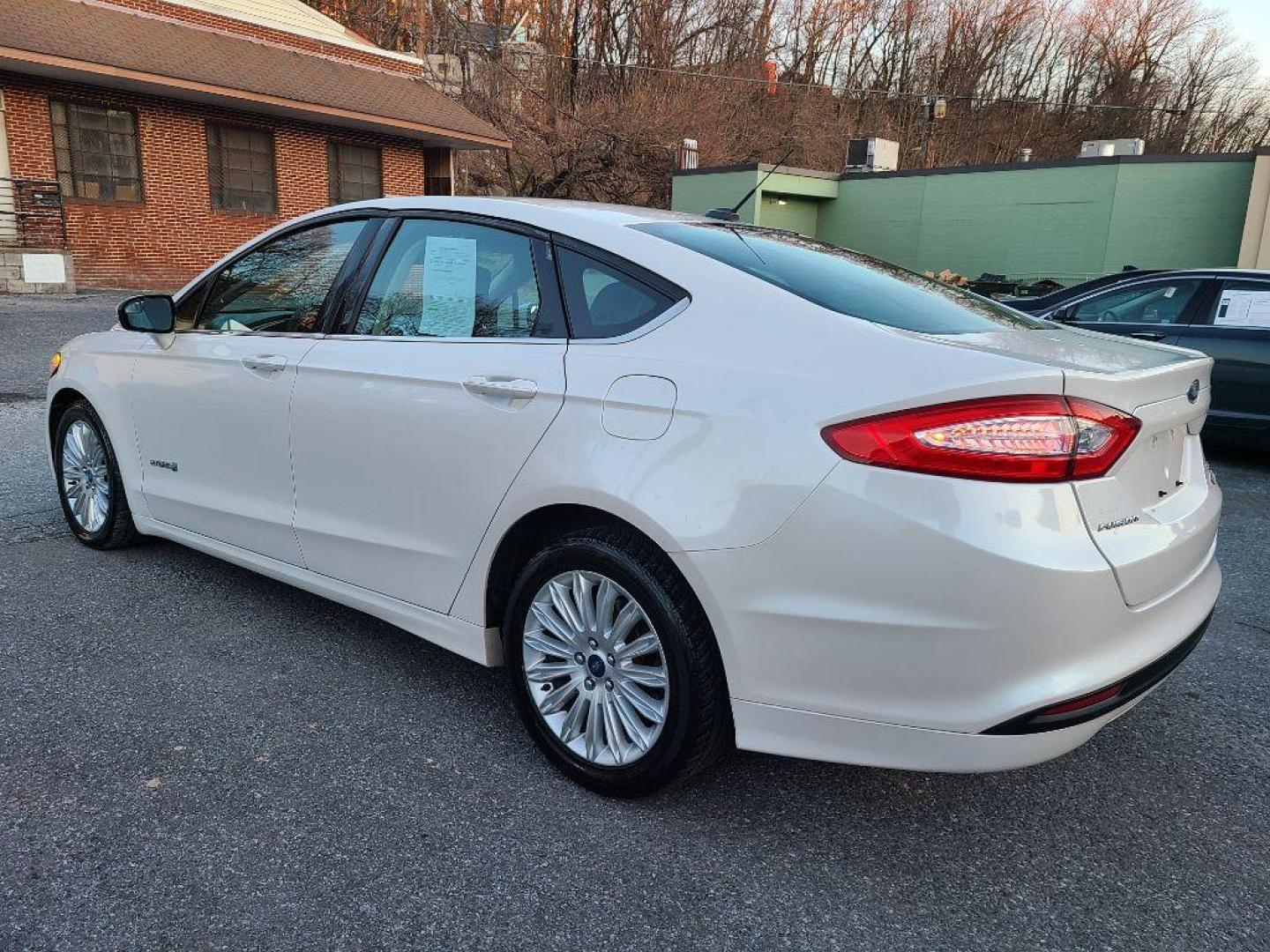 2013 WHITE FORD FUSION SE HYBRID (3FA6P0LUXDR) with an 2.0L engine, Continuously Variable transmission, located at 7981 Paxton Street, Harrisburg, PA, 17111, (717) 561-2926, 40.261490, -76.749229 - WE FINANCE!!! Good Credit/ Bad Credit/ No Credit - ALL Trade-Ins Welcomed!!! ***Guaranteed Credit Approval*** APPLY ONLINE or CALL us TODAY ;) Internet Prices and Marketplace Prices are SPECIAL discounted ***CASH DEALS*** Retail Prices are higher. Please call us to discuss your cash and finan - Photo#2