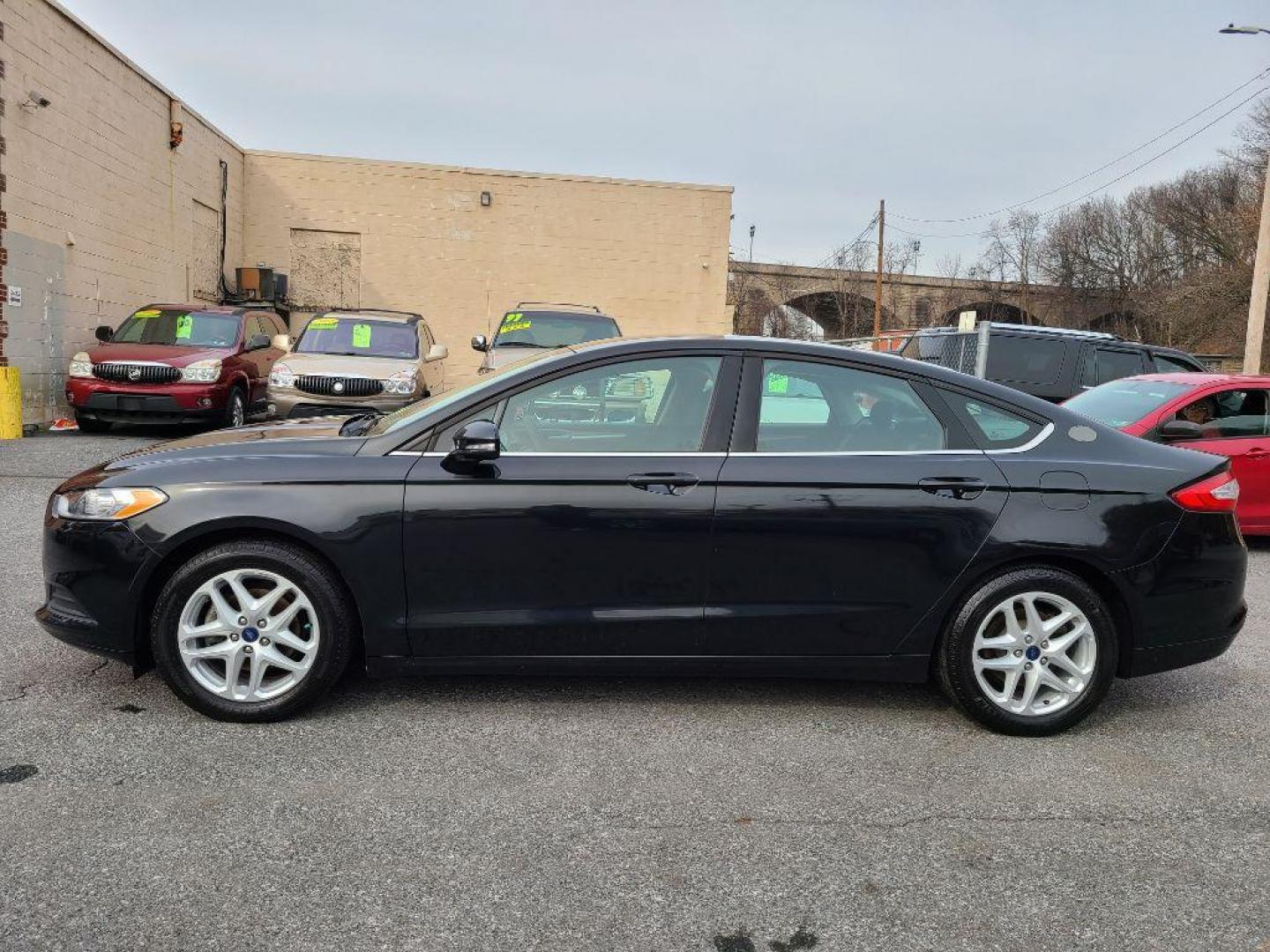 2014 BLACK FORD FUSION SE (3FA6P0H79ER) with an 2.5L engine, Automatic transmission, located at 117 North Cameron Street, Harrisburg, PA, 17101, (717) 963-8962, 40.266762, -76.875259 - WE FINANCE!!! Good Credit/ Bad Credit/ No Credit - ALL Trade-Ins Welcomed!!! ***Guaranteed Credit Approval*** APPLY ONLINE or CALL us TODAY ;) Internet Prices and Marketplace Prices are SPECIAL discounted ***CASH DEALS*** Retail Prices are higher. Please call us to discuss your cash and finan - Photo#1