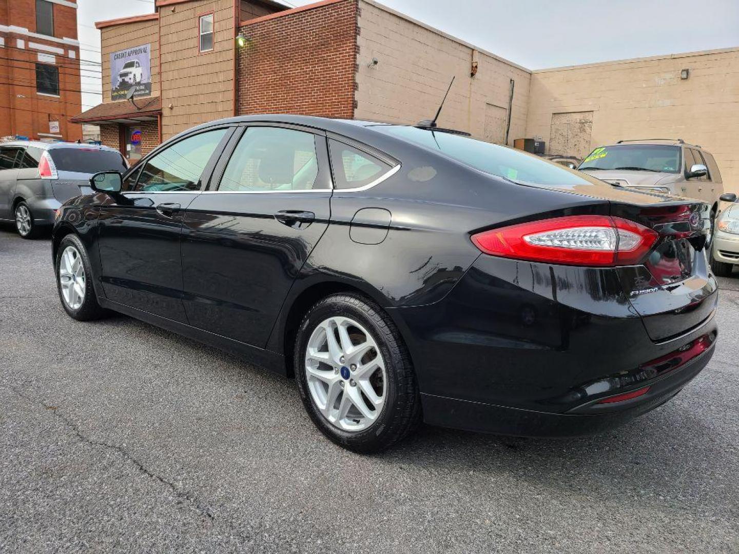 2014 BLACK FORD FUSION SE (3FA6P0H79ER) with an 2.5L engine, Automatic transmission, located at 117 North Cameron Street, Harrisburg, PA, 17101, (717) 963-8962, 40.266762, -76.875259 - WE FINANCE!!! Good Credit/ Bad Credit/ No Credit - ALL Trade-Ins Welcomed!!! ***Guaranteed Credit Approval*** APPLY ONLINE or CALL us TODAY ;) Internet Prices and Marketplace Prices are SPECIAL discounted ***CASH DEALS*** Retail Prices are higher. Please call us to discuss your cash and finan - Photo#2