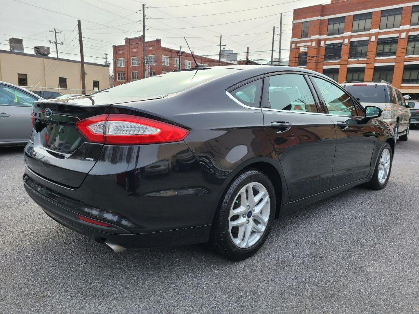 2014 BLACK FORD FUSION SE (3FA6P0H79ER) with an 2.5L engine, Automatic transmission, located at 117 North Cameron Street, Harrisburg, PA, 17101, (717) 963-8962, 40.266762, -76.875259 - WE FINANCE!!! Good Credit/ Bad Credit/ No Credit - ALL Trade-Ins Welcomed!!! ***Guaranteed Credit Approval*** APPLY ONLINE or CALL us TODAY ;) Internet Prices and Marketplace Prices are SPECIAL discounted ***CASH DEALS*** Retail Prices are higher. Please call us to discuss your cash and finan - Photo#4