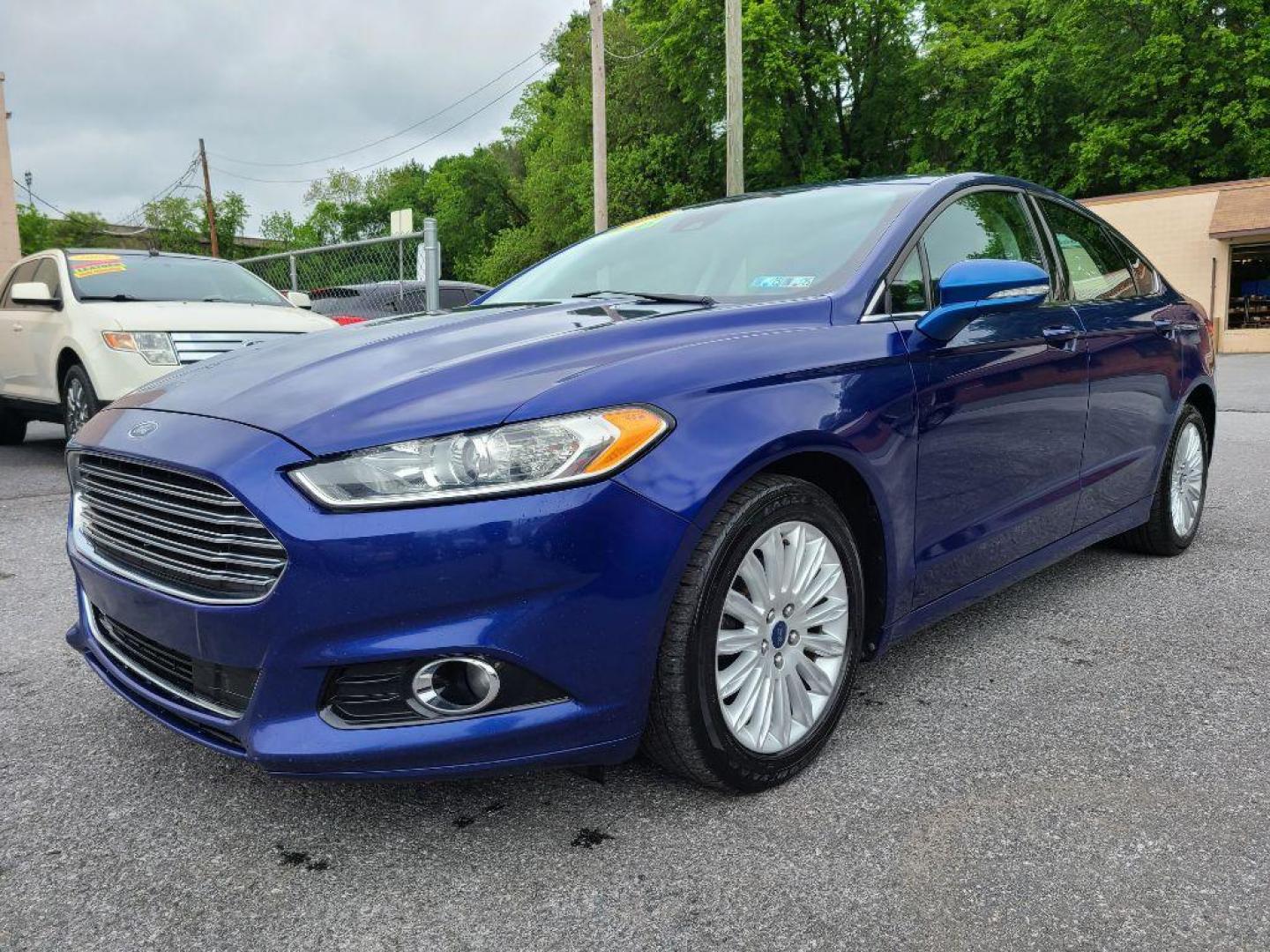 2014 BLUE FORD FUSION SE HYBRID (3FA6P0LU0ER) with an 2.0L engine, Continuously Variable transmission, located at 117 North Cameron Street, Harrisburg, PA, 17101, (717) 963-8962, 40.266762, -76.875259 - WE FINANCE!!! Good Credit/ Bad Credit/ No Credit - ALL Trade-Ins Welcomed!!! ***Guaranteed Credit Approval*** APPLY ONLINE or CALL us TODAY ;) Internet Prices and Marketplace Prices are SPECIAL discounted ***CASH DEALS*** Retail Prices are higher. Please call us to discuss your cash and finan - Photo#0