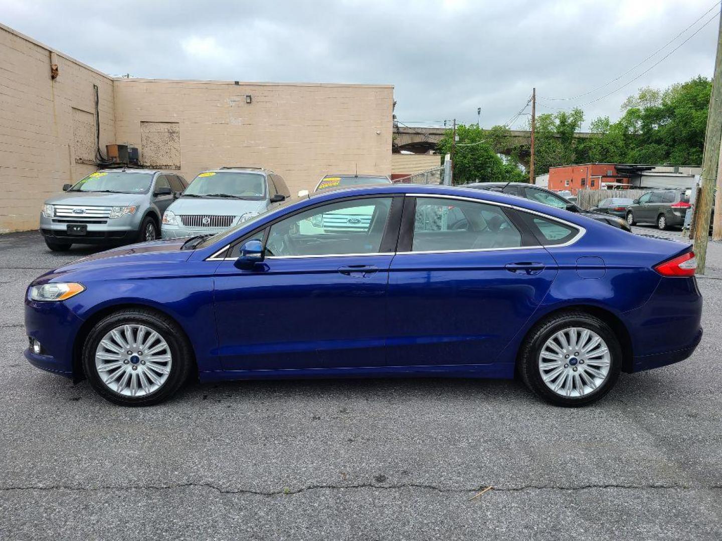 2014 BLUE FORD FUSION SE HYBRID (3FA6P0LU0ER) with an 2.0L engine, Continuously Variable transmission, located at 117 North Cameron Street, Harrisburg, PA, 17101, (717) 963-8962, 40.266762, -76.875259 - WE FINANCE!!! Good Credit/ Bad Credit/ No Credit - ALL Trade-Ins Welcomed!!! ***Guaranteed Credit Approval*** APPLY ONLINE or CALL us TODAY ;) Internet Prices and Marketplace Prices are SPECIAL discounted ***CASH DEALS*** Retail Prices are higher. Please call us to discuss your cash and finan - Photo#1