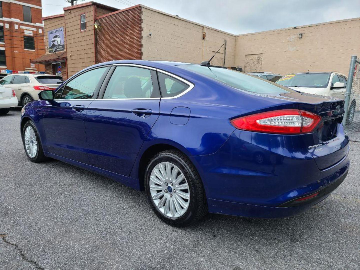 2014 BLUE FORD FUSION SE HYBRID (3FA6P0LU0ER) with an 2.0L engine, Continuously Variable transmission, located at 117 North Cameron Street, Harrisburg, PA, 17101, (717) 963-8962, 40.266762, -76.875259 - WE FINANCE!!! Good Credit/ Bad Credit/ No Credit - ALL Trade-Ins Welcomed!!! ***Guaranteed Credit Approval*** APPLY ONLINE or CALL us TODAY ;) Internet Prices and Marketplace Prices are SPECIAL discounted ***CASH DEALS*** Retail Prices are higher. Please call us to discuss your cash and finan - Photo#2