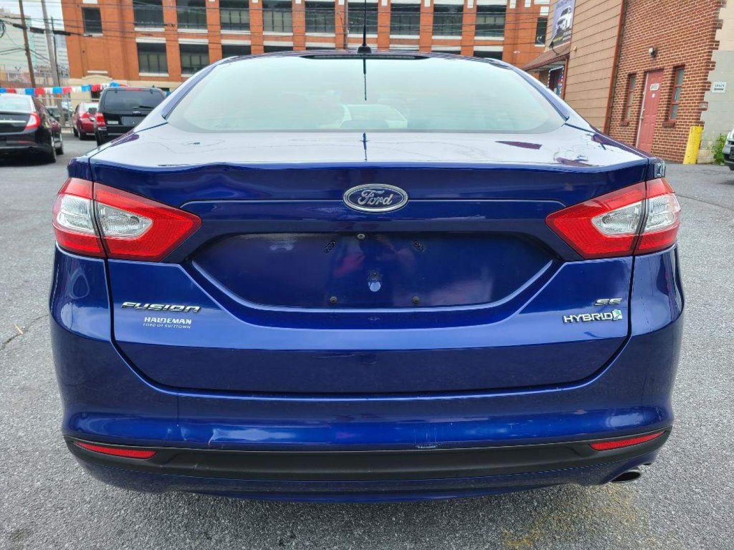 2014 BLUE FORD FUSION SE HYBRID (3FA6P0LU0ER) with an 2.0L engine, Continuously Variable transmission, located at 117 North Cameron Street, Harrisburg, PA, 17101, (717) 963-8962, 40.266762, -76.875259 - WE FINANCE!!! Good Credit/ Bad Credit/ No Credit - ALL Trade-Ins Welcomed!!! ***Guaranteed Credit Approval*** APPLY ONLINE or CALL us TODAY ;) Internet Prices and Marketplace Prices are SPECIAL discounted ***CASH DEALS*** Retail Prices are higher. Please call us to discuss your cash and finan - Photo#3