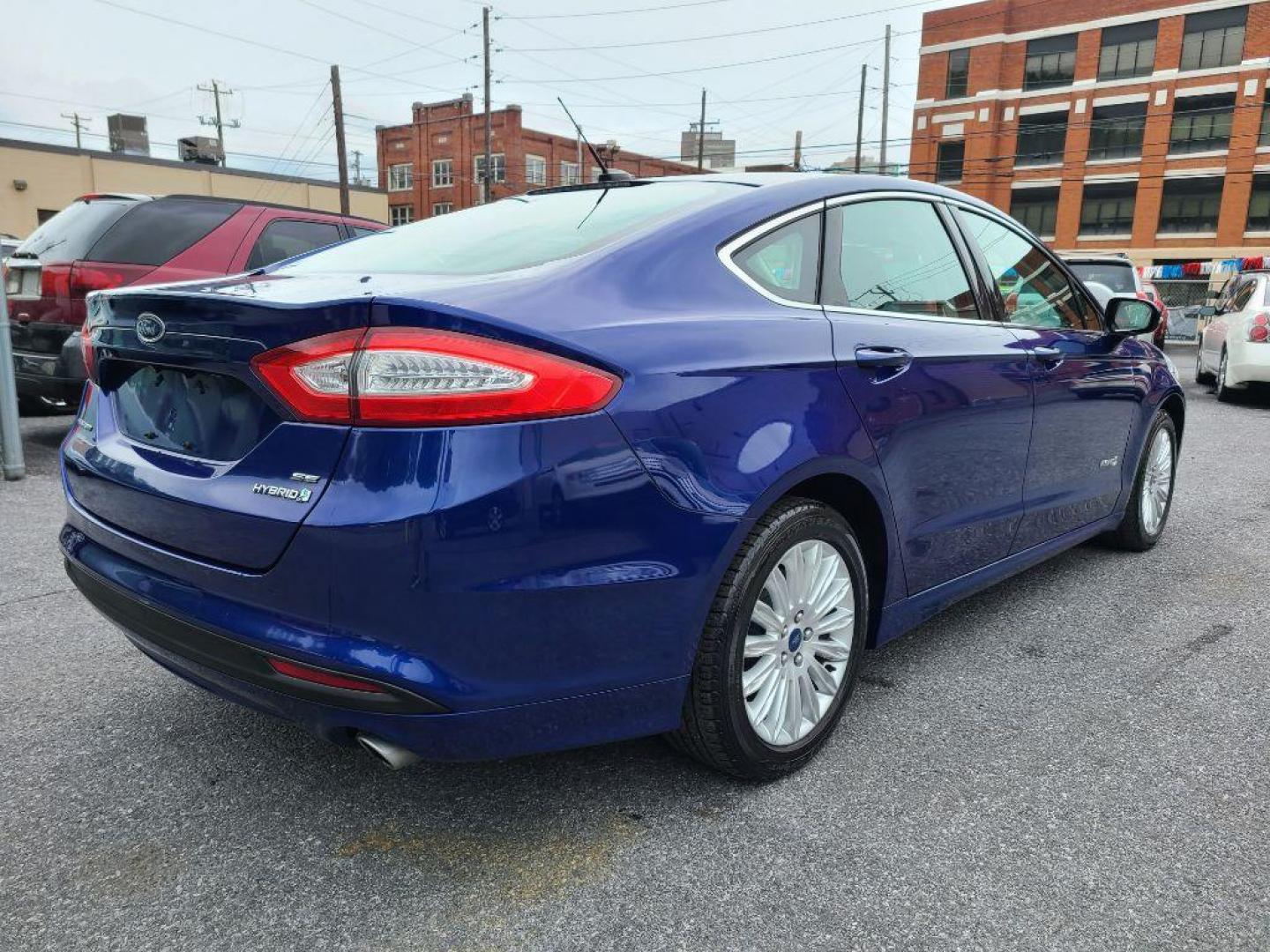 2014 BLUE FORD FUSION SE HYBRID (3FA6P0LU0ER) with an 2.0L engine, Continuously Variable transmission, located at 117 North Cameron Street, Harrisburg, PA, 17101, (717) 963-8962, 40.266762, -76.875259 - WE FINANCE!!! Good Credit/ Bad Credit/ No Credit - ALL Trade-Ins Welcomed!!! ***Guaranteed Credit Approval*** APPLY ONLINE or CALL us TODAY ;) Internet Prices and Marketplace Prices are SPECIAL discounted ***CASH DEALS*** Retail Prices are higher. Please call us to discuss your cash and finan - Photo#4