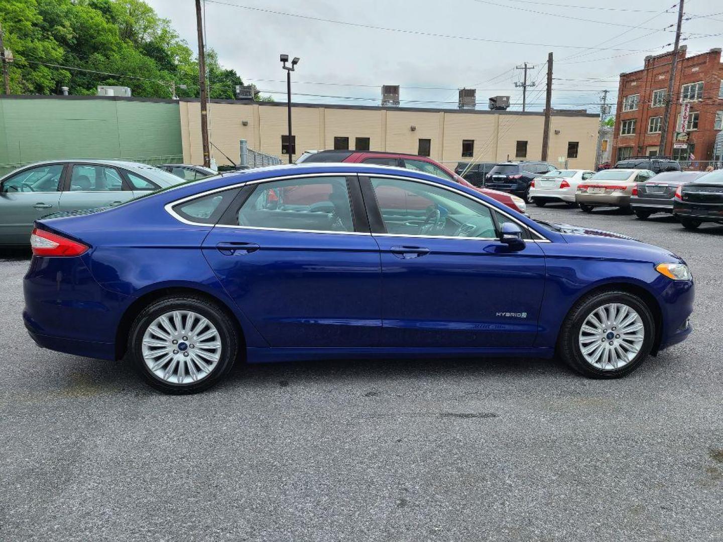 2014 BLUE FORD FUSION SE HYBRID (3FA6P0LU0ER) with an 2.0L engine, Continuously Variable transmission, located at 117 North Cameron Street, Harrisburg, PA, 17101, (717) 963-8962, 40.266762, -76.875259 - WE FINANCE!!! Good Credit/ Bad Credit/ No Credit - ALL Trade-Ins Welcomed!!! ***Guaranteed Credit Approval*** APPLY ONLINE or CALL us TODAY ;) Internet Prices and Marketplace Prices are SPECIAL discounted ***CASH DEALS*** Retail Prices are higher. Please call us to discuss your cash and finan - Photo#5