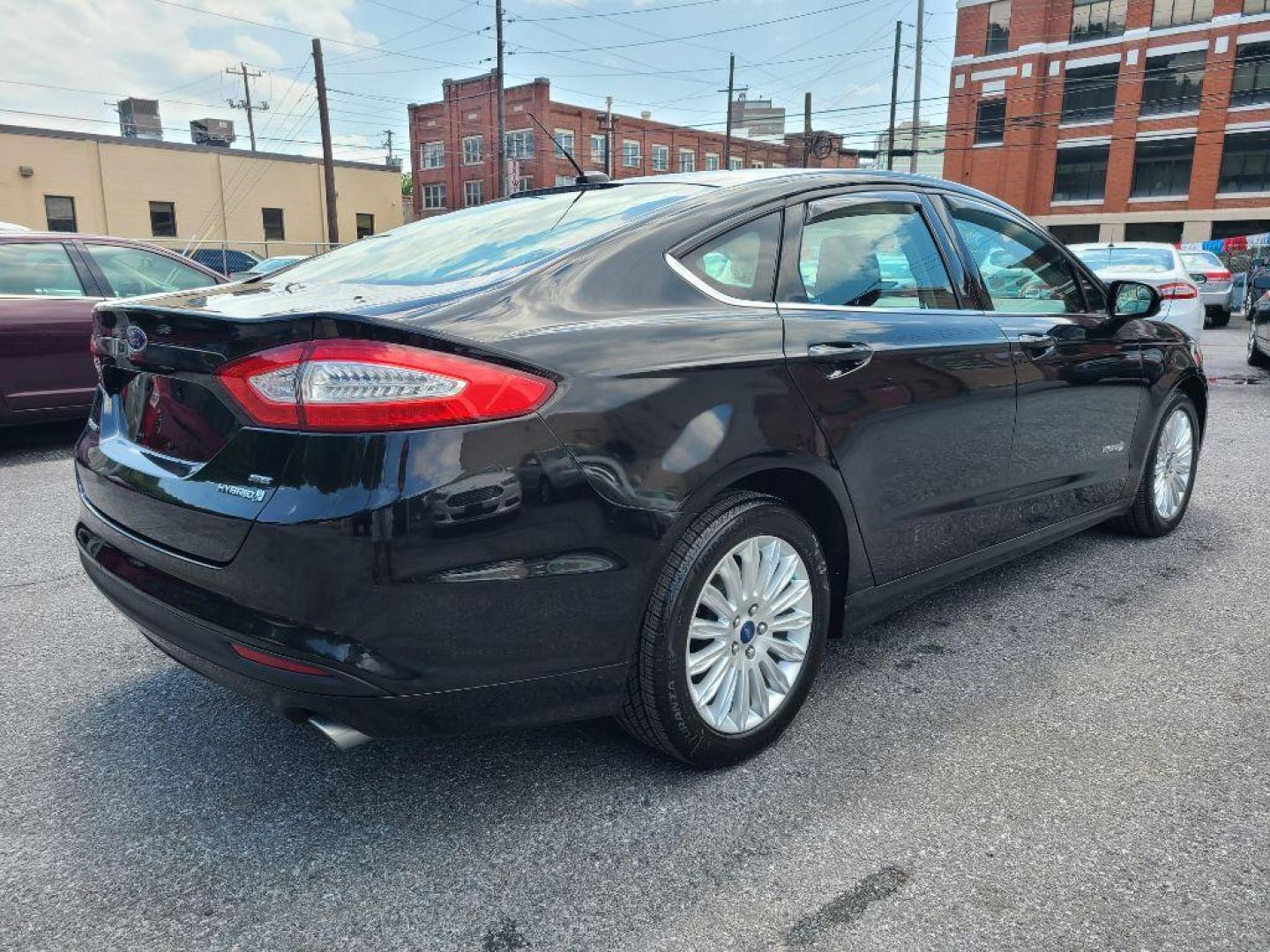 2014 BLACK FORD FUSION SE HYBRID (3FA6P0LU1ER) with an 2.0L engine, Continuously Variable transmission, located at 7981 Paxton Street, Harrisburg, PA, 17111, (717) 561-2926, 40.261490, -76.749229 - WE FINANCE!!! Good Credit/ Bad Credit/ No Credit - ALL Trade-Ins Welcomed!!! ***Guaranteed Credit Approval*** APPLY ONLINE or CALL us TODAY ;) Internet Prices and Marketplace Prices are SPECIAL discounted ***CASH DEALS*** Retail Prices are higher. Please call us to discuss your cash and finan - Photo#4