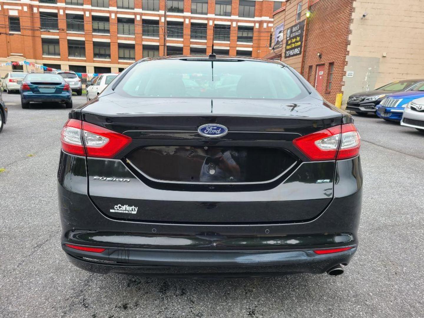 2015 BLACK FORD FUSION SE (3FA6P0H70FR) with an 2.5L engine, Automatic transmission, located at 7981 Paxton Street, Harrisburg, PA, 17111, (717) 561-2926, 40.261490, -76.749229 - WE FINANCE!!! Good Credit/ Bad Credit/ No Credit - ALL Trade-Ins Welcomed!!! ***Guaranteed Credit Approval*** APPLY ONLINE or CALL us TODAY ;) Internet Prices and Marketplace Prices are SPECIAL discounted ***CASH DEALS*** Retail Prices are higher. Please call us to discuss your cash and finan - Photo#3