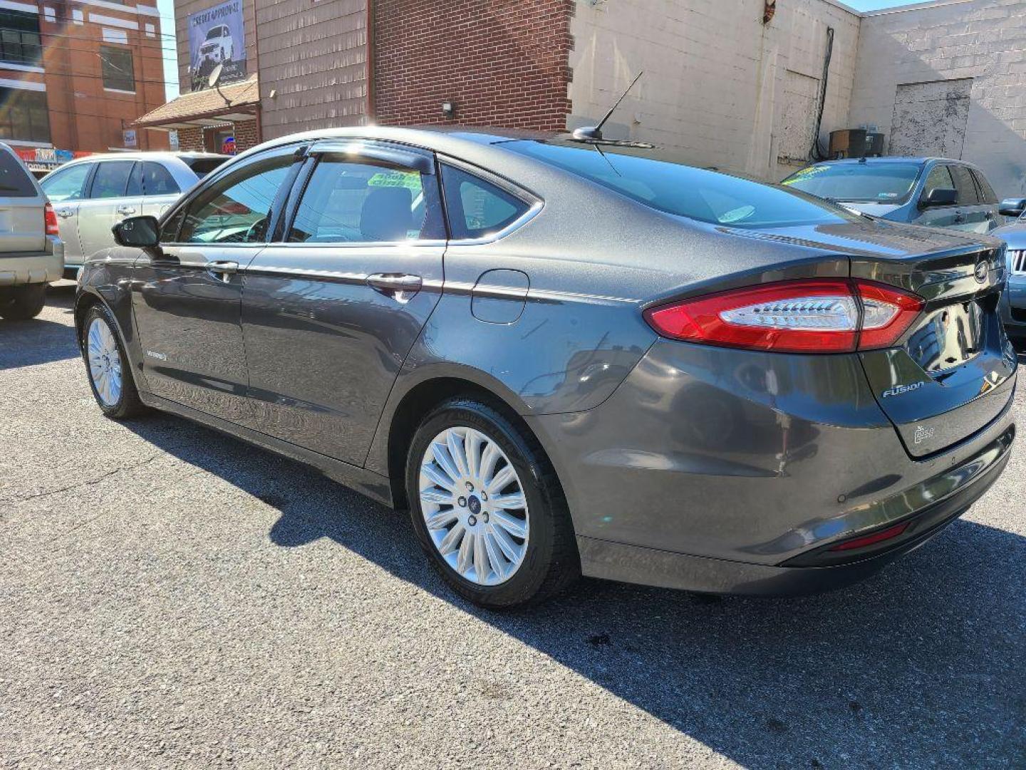 2015 GRAY FORD FUSION SE HYBRID (3FA6P0LU0FR) with an 2.0L engine, Continuously Variable transmission, located at 7981 Paxton Street, Harrisburg, PA, 17111, (717) 561-2926, 40.261490, -76.749229 - WE FINANCE!!! Good Credit/ Bad Credit/ No Credit - ALL Trade-Ins Welcomed!!! ***Guaranteed Credit Approval*** APPLY ONLINE or CALL us TODAY ;) Internet Prices and Marketplace Prices are SPECIAL discounted ***CASH DEALS*** Retail Prices are higher. Please call us to discuss your cash and finan - Photo#2