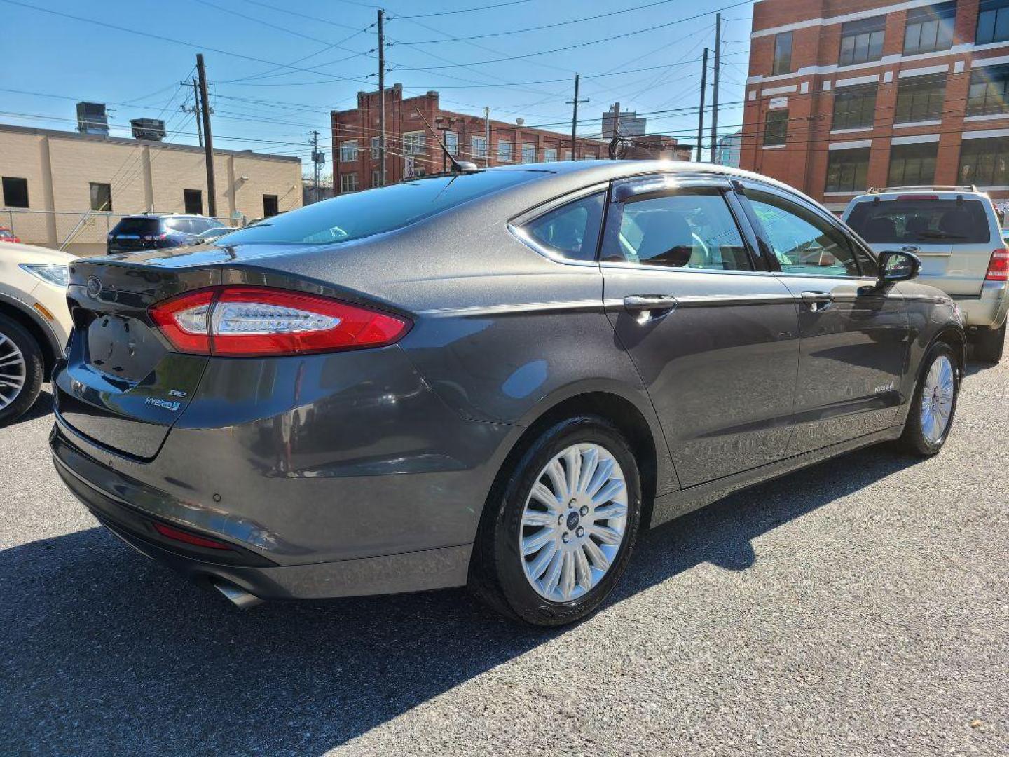 2015 GRAY FORD FUSION SE HYBRID (3FA6P0LU0FR) with an 2.0L engine, Continuously Variable transmission, located at 7981 Paxton Street, Harrisburg, PA, 17111, (717) 561-2926, 40.261490, -76.749229 - WE FINANCE!!! Good Credit/ Bad Credit/ No Credit - ALL Trade-Ins Welcomed!!! ***Guaranteed Credit Approval*** APPLY ONLINE or CALL us TODAY ;) Internet Prices and Marketplace Prices are SPECIAL discounted ***CASH DEALS*** Retail Prices are higher. Please call us to discuss your cash and finan - Photo#4