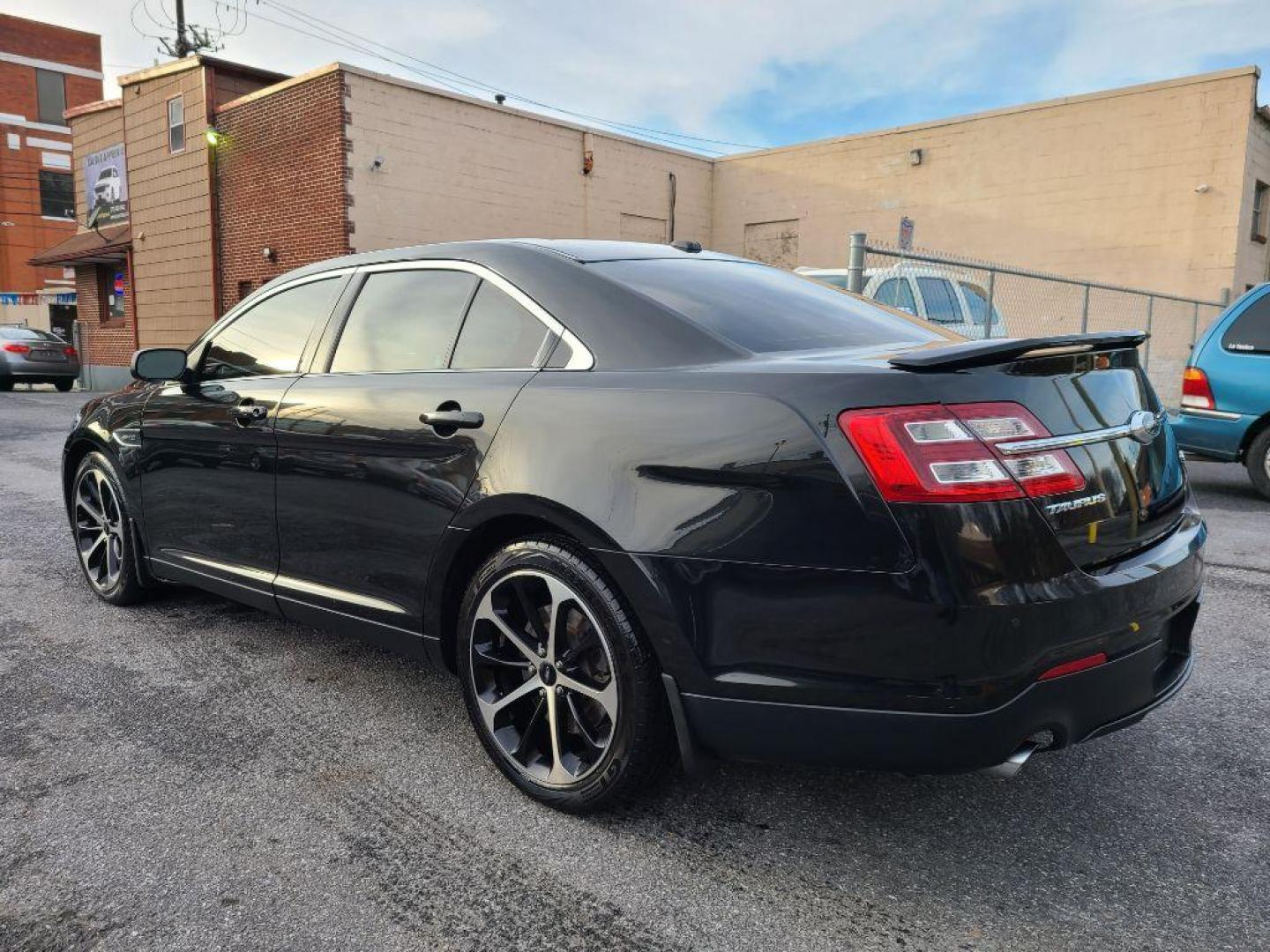 2015 BLACK FORD TAURUS SHO (1FAHP2KT3FG) with an 3.5L engine, Automatic transmission, located at 117 North Cameron Street, Harrisburg, PA, 17101, (717) 963-8962, 40.266762, -76.875259 - WE FINANCE!!! Good Credit/ Bad Credit/ No Credit - ALL Trade-Ins Welcomed!!! ***Guaranteed Credit Approval*** APPLY ONLINE or CALL us TODAY ;) Internet Prices and Marketplace Prices are SPECIAL discounted ***CASH DEALS*** Retail Prices are higher. Please call us to discuss your cash and finan - Photo#2