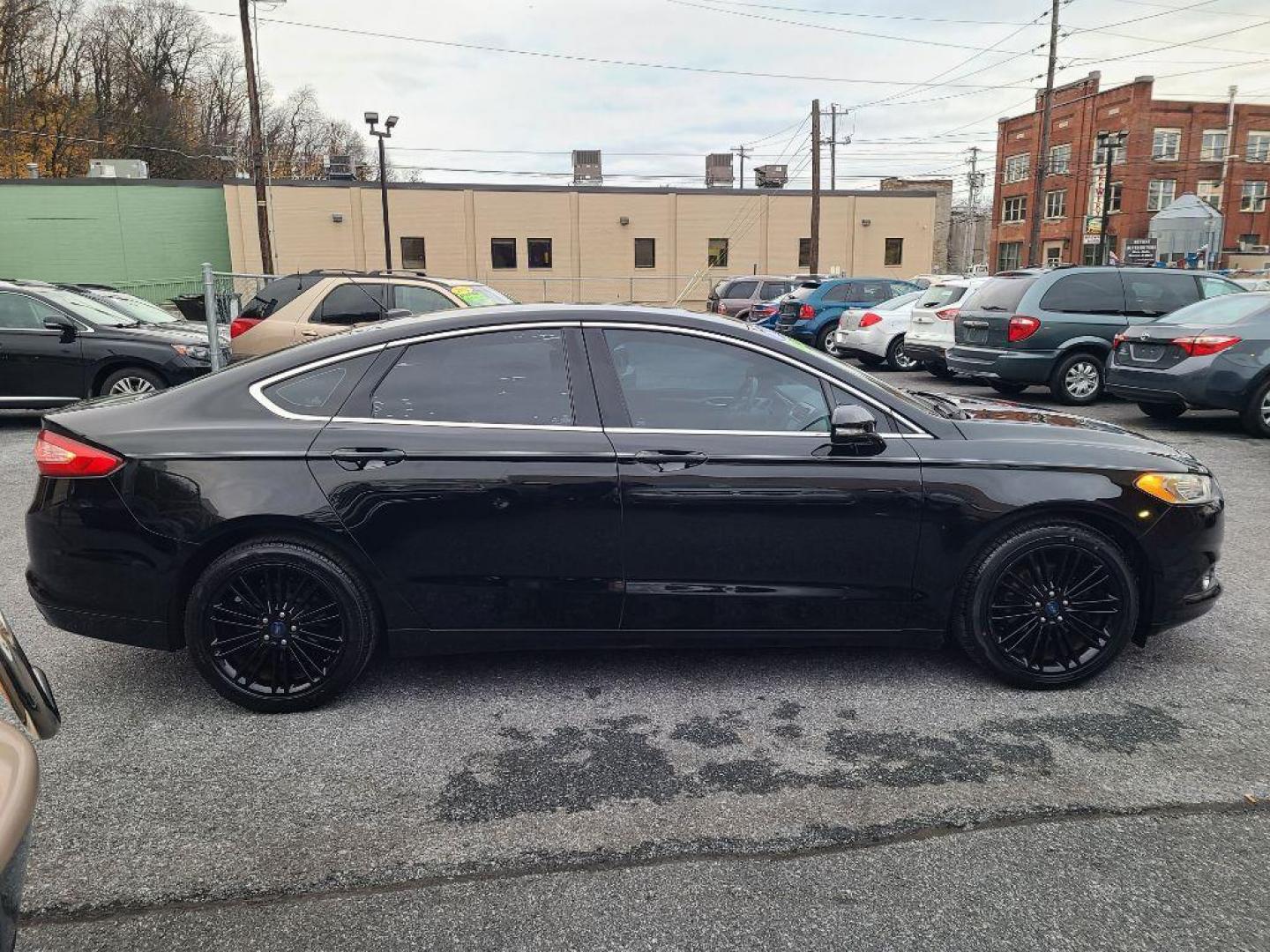 2016 BLACK FORD FUSION SE (3FA6P0HD2GR) with an 1.5L engine, Automatic transmission, located at 7981 Paxton Street, Harrisburg, PA, 17111, (717) 561-2926, 40.261490, -76.749229 - WE FINANCE!!! Good Credit/ Bad Credit/ No Credit - ALL Trade-Ins Welcomed!!! ***Guaranteed Credit Approval*** APPLY ONLINE or CALL us TODAY ;) Internet Prices and Marketplace Prices are SPECIAL discounted ***CASH DEALS*** Retail Prices are higher. Please call us to discuss your cash and finan - Photo#5