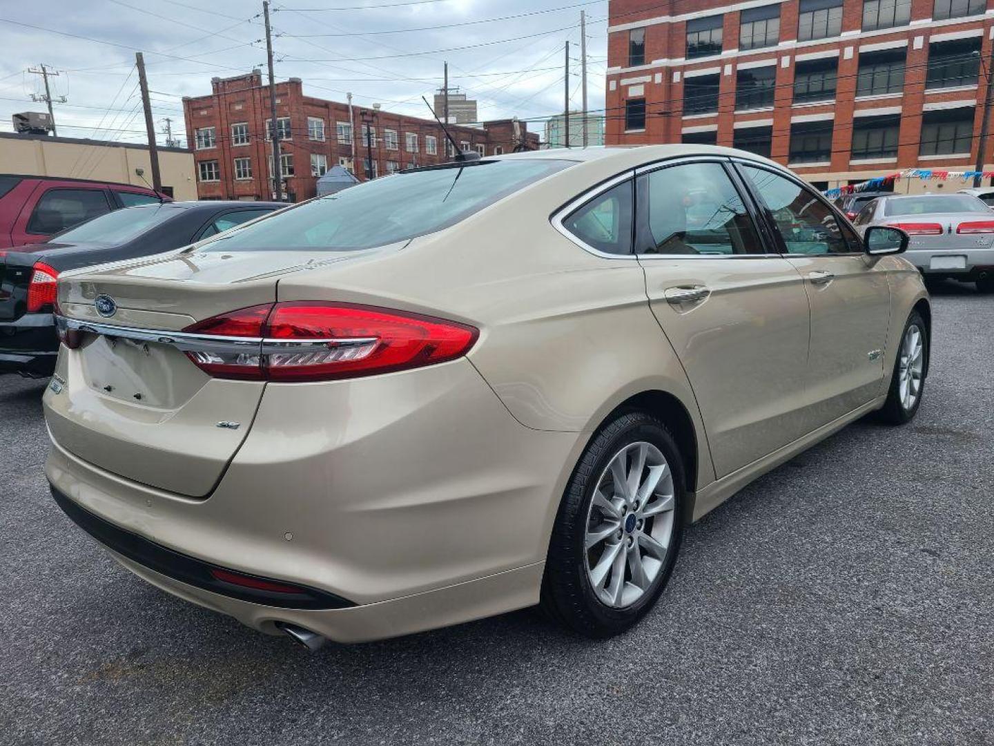 2017 TAN FORD FUSION SE PHEV (3FA6P0PU2HR) with an 2.0L engine, Continuously Variable transmission, located at 117 North Cameron Street, Harrisburg, PA, 17101, (717) 963-8962, 40.266762, -76.875259 - WE FINANCE!!! Good Credit/ Bad Credit/ No Credit - ALL Trade-Ins Welcomed!!! ***Guaranteed Credit Approval*** APPLY ONLINE or CALL us TODAY ;) Internet Prices and Marketplace Prices are SPECIAL discounted ***CASH DEALS*** Retail Prices are higher. Please call us to discuss your cash and finan - Photo#4